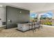 Outdoor kitchen with granite countertop and bar stools at 912 160Th E Ln, Bradenton, FL 34212