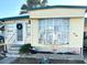 Mobile home exterior with landscaping and flamingo decor at 9790 66Th N St # 340, Pinellas Park, FL 33782