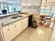 Clean and functional kitchen offering a double sink and modern appliances at 9790 66Th N St # 340, Pinellas Park, FL 33782