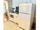 White kitchen with appliances, offering ample storage and counter space at 9790 66Th N St # 340, Pinellas Park, FL 33782