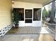 Screened porch with tiled floor and potted plant at 9790 66Th N St # 340, Pinellas Park, FL 33782