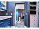 Bathroom with blue vanity, walk-in shower, and tile flooring at 13181 Linzia Ln, Spring Hill, FL 34609