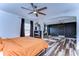 Bright bedroom with ensuite bathroom and large bed at 13181 Linzia Ln, Spring Hill, FL 34609
