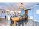 Kitchen and dining area with farmhouse table and lighting at 13181 Linzia Ln, Spring Hill, FL 34609
