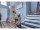 Inviting entryway with stylish decor, wood floors, and a staircase at 13181 Linzia Ln, Spring Hill, FL 34609