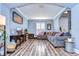 Spacious Gathering room featuring a large sectional sofa and wood-look flooring at 13181 Linzia Ln, Spring Hill, FL 34609