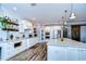 Modern kitchen with white cabinets, large island, and stainless steel appliances at 13181 Linzia Ln, Spring Hill, FL 34609