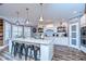 Modern kitchen with white cabinets, large island, and stainless steel appliances at 13181 Linzia Ln, Spring Hill, FL 34609