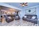 Open living area with kitchen and leather seating at 13181 Linzia Ln, Spring Hill, FL 34609