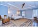 Spacious main bedroom with wood-look floors and ceiling fan at 13181 Linzia Ln, Spring Hill, FL 34609