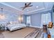 Main bedroom with wood-like flooring and accent wall at 13181 Linzia Ln, Spring Hill, FL 34609