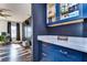 Well-organized pantry with blue cabinets and white countertops at 13181 Linzia Ln, Spring Hill, FL 34609