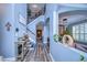 Elegant two-story entryway showcasing a grand staircase and hardwood floors at 13181 Linzia Ln, Spring Hill, FL 34609