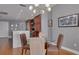 Modern dining area with glass table and a chandelier at 1120 E Kennedy Blvd # 1221, Tampa, FL 33602