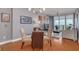 Modern dining area with a glass table, hardwood floors, and city views at 1120 E Kennedy Blvd # 1221, Tampa, FL 33602