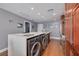 Modern kitchen with stainless steel appliances and in-unit laundry at 1120 E Kennedy Blvd # 1221, Tampa, FL 33602