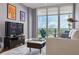 Spacious living room boasts hardwood floors, city views, and ample natural light at 1120 E Kennedy Blvd # 1221, Tampa, FL 33602