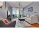 Modern living room with hardwood floors and city views at 1120 E Kennedy Blvd # 1221, Tampa, FL 33602
