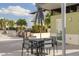 Community patio with table, chairs, and grill at 1120 E Kennedy Blvd # 1221, Tampa, FL 33602