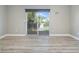 Bedroom featuring sliding glass doors to a private deck at 115 Canal Ave # 1, Indian Rocks Beach, FL 33785