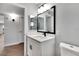 Bathroom featuring a white vanity, quartz countertop, modern fixtures, and framed mirror at 1201 Harkness Way, Sun City Center, FL 33573
