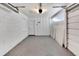 Clean and spacious garage with painted concrete floor and ample storage at 1201 Harkness Way, Sun City Center, FL 33573