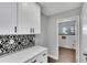 Kitchen with new countertops and a view to the laundry room at 1201 Harkness Way, Sun City Center, FL 33573