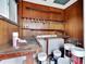 Interior view of shed featuring wood paneling, shelves, and storage space at 1201 Harkness Way, Sun City Center, FL 33573