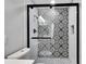 Black and white patterned shower with subway tile at 1201 Harkness Way, Sun City Center, FL 33573