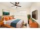 Cozy bedroom featuring warm tones, stylish decor, a ceiling fan, and natural light, creating a relaxing retreat at 12506 Forest Hills Dr, Tampa, FL 33612
