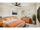 Comfortable bedroom with warm wood accents, a bright window, and stylish decor creating a peaceful space at 12506 Forest Hills Dr, Tampa, FL 33612