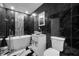 Elegant bathroom with dark tile and soaking tub at 13150 94Th Ave N, Seminole, FL 33776