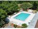 Refreshing community pool with ample deck space for lounging at 13209 Woodward Dr, Hudson, FL 34667