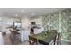Kitchen dining area with a table for six and tropical-themed wallpaper at 18125 Canopy Pl, Lakewood Ranch, FL 34211