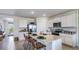 Modern kitchen with white cabinets, granite countertops, and an island at 18125 Canopy Pl, Lakewood Ranch, FL 34211