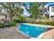 Inviting kidney-shaped pool with brick pavers and a spacious patio at 2220 12Th N St, St Petersburg, FL 33704