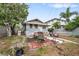 Backyard patio with seating area and trash bags at 2244 2Nd N Ave, St Petersburg, FL 33713