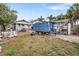 Large backyard with a dumpster and debris at 2244 2Nd N Ave, St Petersburg, FL 33713