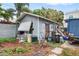 Detached garage with various items and debris at 2244 2Nd N Ave, St Petersburg, FL 33713