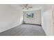 Bright bedroom with grey carpet and ceiling fan at 2287 Philippine Dr # 31, Clearwater, FL 33763