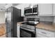 Stainless steel appliances and granite countertops in the kitchen at 2300 30Th N Ave, St Petersburg, FL 33713