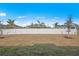 Private backyard with a new white vinyl fence at 23234 Alaska Ave, Port Charlotte, FL 33952