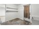 Clean laundry room with built-in shelving and exterior access at 3207 River Cove Dr, Tampa, FL 33614