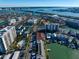 Aerial view of waterfront community including residences, docks, and waterfront at 354 Larboard Way, Clearwater Beach, FL 33767