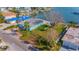 Aerial view showcasing the house and the expansive waterfront lot at 409 161St Ave, Redington Beach, FL 33708