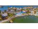 Aerial view of waterfront home, yard, and dock at 409 161St Ave, Redington Beach, FL 33708