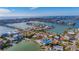 Aerial view of waterfront home with private dock and access to the bay at 409 161St Ave, Redington Beach, FL 33708