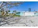 Spacious backyard with patio and mature tree at 409 161St Ave, Redington Beach, FL 33708