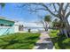 Pathway leading to waterfront with a relaxing seating area at 409 161St Ave, Redington Beach, FL 33708