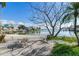 Relaxing patio overlooking waterfront with seating for four at 409 161St Ave, Redington Beach, FL 33708